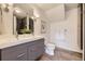Elegant bathroom featuring a double vanity, modern fixtures, and tiled floors at 9481 E Mansfield Ave # 301, Aurora, CO 80014