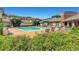 Community pool with lounge chairs and well-maintained landscaping at 9481 E Mansfield Ave # 301, Aurora, CO 80014
