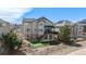 Backyard features a putting green, stone patio and multi-level deck, perfect for entertaining or relaxation at 26989 E Friend Pl, Aurora, CO 80016