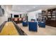 Finished basement with a shuffleboard table, bar area, and an exercise area at 26989 E Friend Pl, Aurora, CO 80016