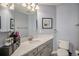 Neutral bathroom with a sink vanity, large mirror and decorative accents at 26989 E Friend Pl, Aurora, CO 80016