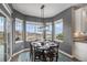 Charming dining area with lake views and a stylish light fixture at 26989 E Friend Pl, Aurora, CO 80016