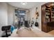 Home gym with exercise equipment, wall art, and natural light from a window at 26989 E Friend Pl, Aurora, CO 80016