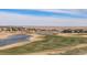 A golf course community featuring ponds, fairways, and beautiful homes, offering a serene and active lifestyle at 26989 E Friend Pl, Aurora, CO 80016