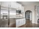 Bright kitchen with stainless steel appliances, white cabinetry and granite counters at 26989 E Friend Pl, Aurora, CO 80016