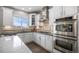 Updated kitchen with stainless steel appliances and a gas cooktop at 26989 E Friend Pl, Aurora, CO 80016