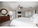 Inviting main bedroom featuring a fireplace, an ensuite, and a cozy atmosphere at 26989 E Friend Pl, Aurora, CO 80016