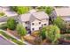 An aerial view of this property features mature trees, a well-kept lawn, and beautiful landscaping at 23870 E Dorado Pl, Aurora, CO 80016