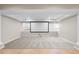 Basement room with projector screen, recessed lighting, and large windows, perfect for media or entertaining at 23870 E Dorado Pl, Aurora, CO 80016