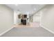 Partially finished basement with carpet, tile, a bar area and a kitchen at 23870 E Dorado Pl, Aurora, CO 80016
