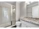 This bathroom features a granite countertop vanity and a glass-enclosed shower with tile surround at 23870 E Dorado Pl, Aurora, CO 80016