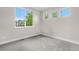Well-lit bedroom with carpet flooring, and large windows overlooking the landscape at 23870 E Dorado Pl, Aurora, CO 80016