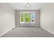 Bright bedroom featuring a window seat and carpeted flooring at 23870 E Dorado Pl, Aurora, CO 80016