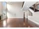 Spacious living room with hardwood floors, a fireplace, and open staircase to the second floor at 23870 E Dorado Pl, Aurora, CO 80016