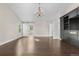 Bright and spacious main bedroom with hardwood floors, barn door leading to the bathroom, and modern fixtures at 23870 E Dorado Pl, Aurora, CO 80016