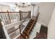 Elegant staircase with wood and iron finishes, connecting multiple levels of the home at 23870 E Dorado Pl, Aurora, CO 80016