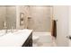 Bathroom features a shower over the tub and single sink vanity at 6307 Dayton Ct, Denver, CO 80238