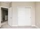 Bedroom features an open door and a sliding closet door at 6307 Dayton Ct, Denver, CO 80238