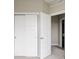 Bedroom features sliding closet doors and an open door leading to another room at 6307 Dayton Ct, Denver, CO 80238