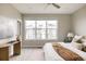 Bright main bedroom with a large window, desk, comfortable bed, and ample natural light at 6307 Dayton Ct, Denver, CO 80238