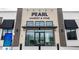 Facade of the Pearl Market & Wine, showcasing its modern design and convenient neighborhood shopping at 6307 Dayton Ct, Denver, CO 80238