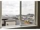 Window view of rooftops and city skyline in the distance at 6307 Dayton Ct, Denver, CO 80238