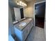 This bathroom features dual sinks, granite countertop and tile floors at 19193 E Amherst Dr, Aurora, CO 80013