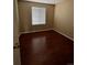 This bedroom has wood floors and a window for natural light at 19193 E Amherst Dr, Aurora, CO 80013