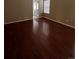This bedroom has wood floors and neutral colored walls at 19193 E Amherst Dr, Aurora, CO 80013