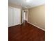 Empty bedroom featuring hardwood floors and a closet at 19193 E Amherst Dr, Aurora, CO 80013
