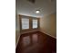 Empty bedroom with hardwood floors and natural light at 19193 E Amherst Dr, Aurora, CO 80013
