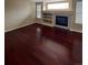 The living room has hardwood floors, fireplace, and custom built-ins at 19193 E Amherst Dr, Aurora, CO 80013