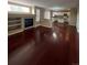 Open concept living space with hardwood floors, fireplace, and a modern kitchen at 19193 E Amherst Dr, Aurora, CO 80013