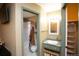 Well-lit bathroom with a shower-tub, sink, marble countertop and shelving at 7978 Chase Cir # G, Arvada, CO 80003