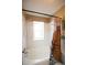 Bright bathroom with white tile, bathtub, shower, and eye-catching shower curtain at 7978 Chase Cir # G, Arvada, CO 80003