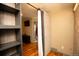 Bedroom including shelving, closet, and an ensuite bathroom at 7978 Chase Cir # G, Arvada, CO 80003