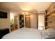 Spacious bedroom with closet, TV and ensuite bathroom at 7978 Chase Cir # G, Arvada, CO 80003