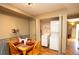 Cozy dining area with seating for four, convenient washer and dryer closet, and neutral decor at 7978 Chase Cir # G, Arvada, CO 80003