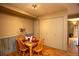 Dining room with a rustic feel, wooden floors, wood trim and table with 4 chairs at 7978 Chase Cir # G, Arvada, CO 80003