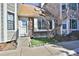 Charming townhome with brick facade, concrete steps, and drought-tolerant landscaping at 7978 Chase Cir # G, Arvada, CO 80003