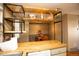 Bright eat in kitchen with open shelves, wood countertops and modern appliances at 7978 Chase Cir # G, Arvada, CO 80003