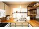 Charming kitchen featuring butcher block counters and open shelving at 7978 Chase Cir # G, Arvada, CO 80003