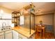 Bright kitchen featuring butcher block counters, stainless steel sink, and decor at 7978 Chase Cir # G, Arvada, CO 80003