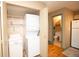 Convenient laundry room with stackable washer/dryer and built-in storage cabinets at 7978 Chase Cir # G, Arvada, CO 80003
