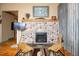 Living room showcasing a stone fireplace, rustic accents, and hardwood flooring at 7978 Chase Cir # G, Arvada, CO 80003