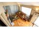 A bright living room featuring hardwood floors, stone fireplace, and large window at 7978 Chase Cir # G, Arvada, CO 80003