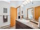 Bathroom featuring a vessel sink, mosaic tile backsplash, and modern lighting at 7350 Timber Trail Rd, Evergreen, CO 80439