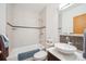 Well lit bathroom with shower and tub combo, vessel sink, and decorative tile backsplash at 7350 Timber Trail Rd, Evergreen, CO 80439