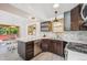This kitchen has stainless steel appliances, a stylish backsplash, and beautiful counters at 7350 Timber Trail Rd, Evergreen, CO 80439