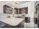 This kitchen offers stainless steel appliances, a stylish backsplash, and beautiful counters at 7350 Timber Trail Rd, Evergreen, CO 80439
